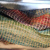 cotton yarn of various weights before being cut into “caterpillars”