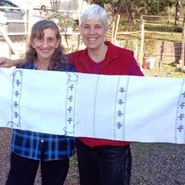 Chanuka placemats by Sheila O'Hara (right) and her student Suzanne Britz